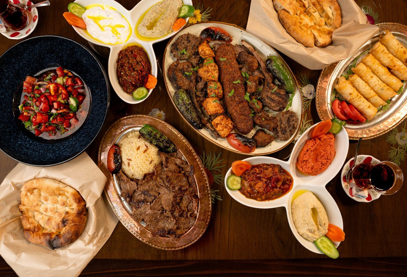 Turkish mixed grill spread with kebabs, pide, and mezze — restaurant food photography
