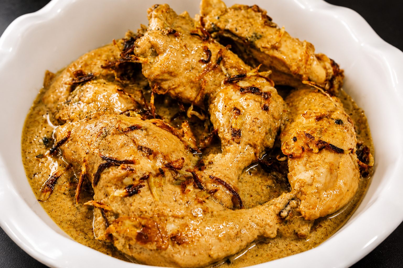 Korma in a serving dish — food photography