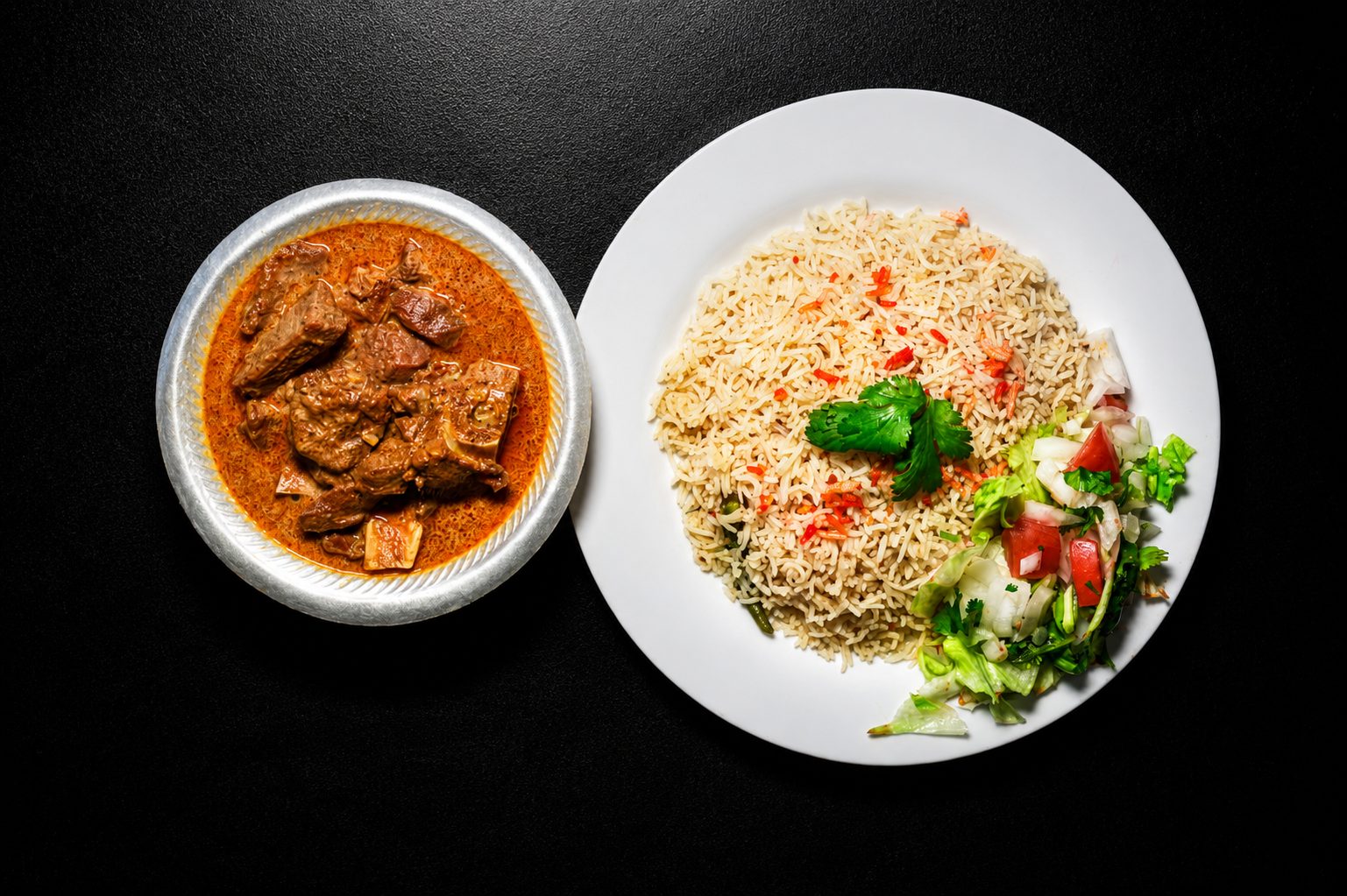 Slow-cooked lamb curry plated for service — food photography