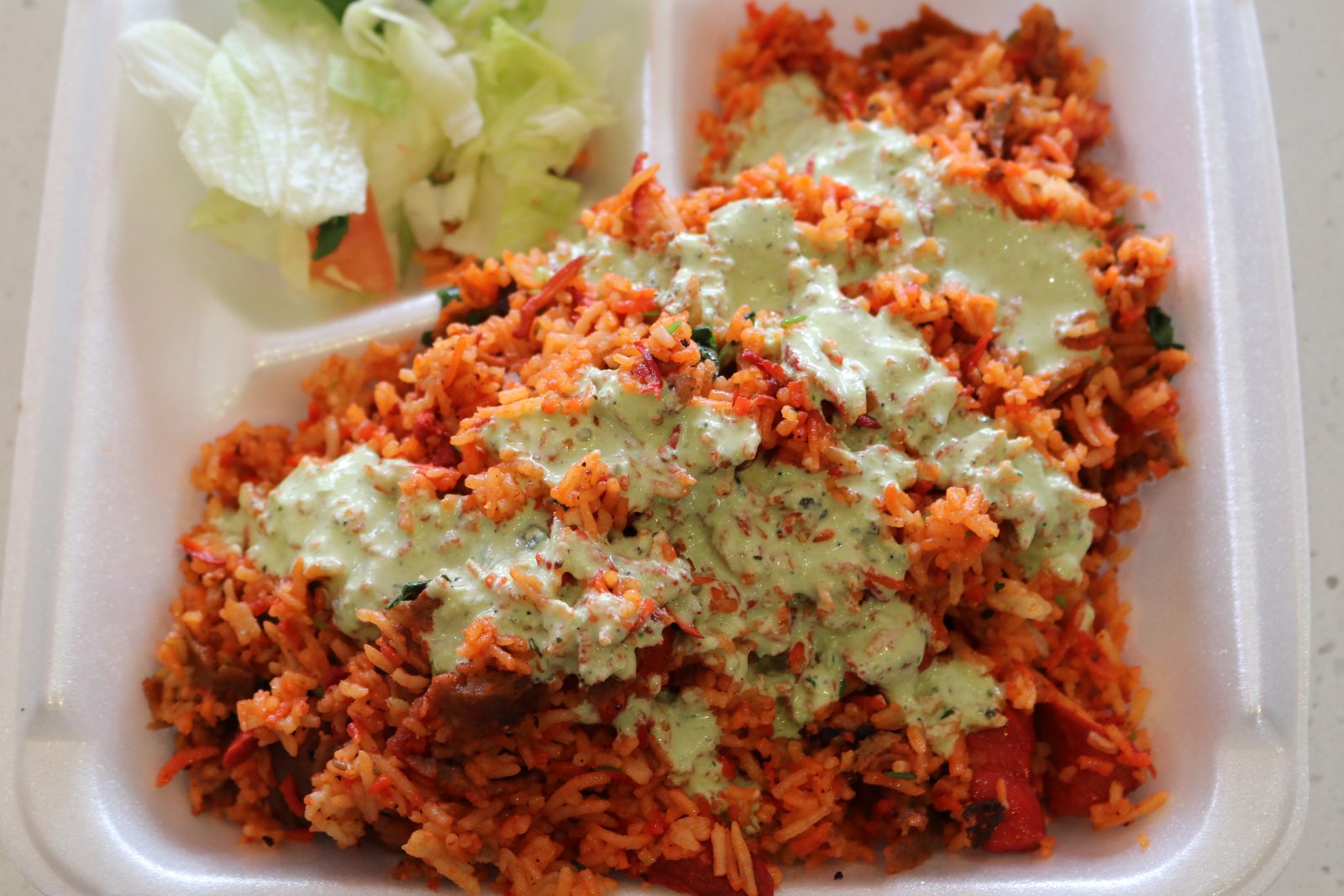 Herbed green rice plated for service — food photography