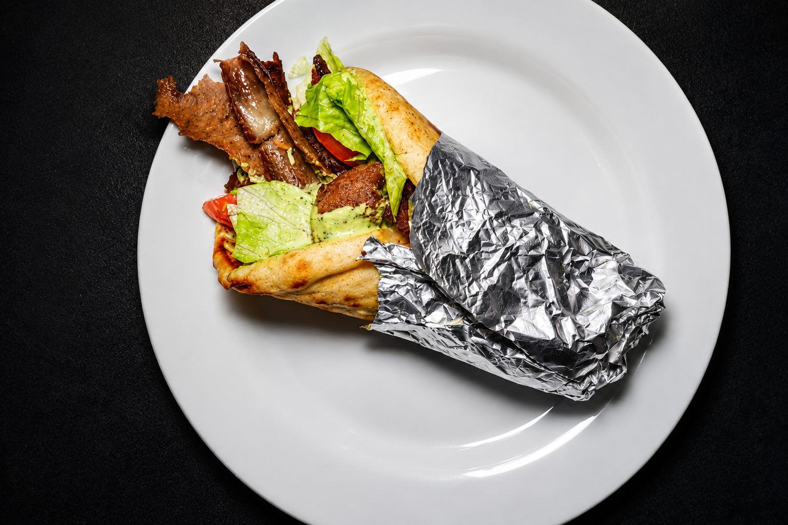 Shawarma platter with rice and grilled garnish — food photography