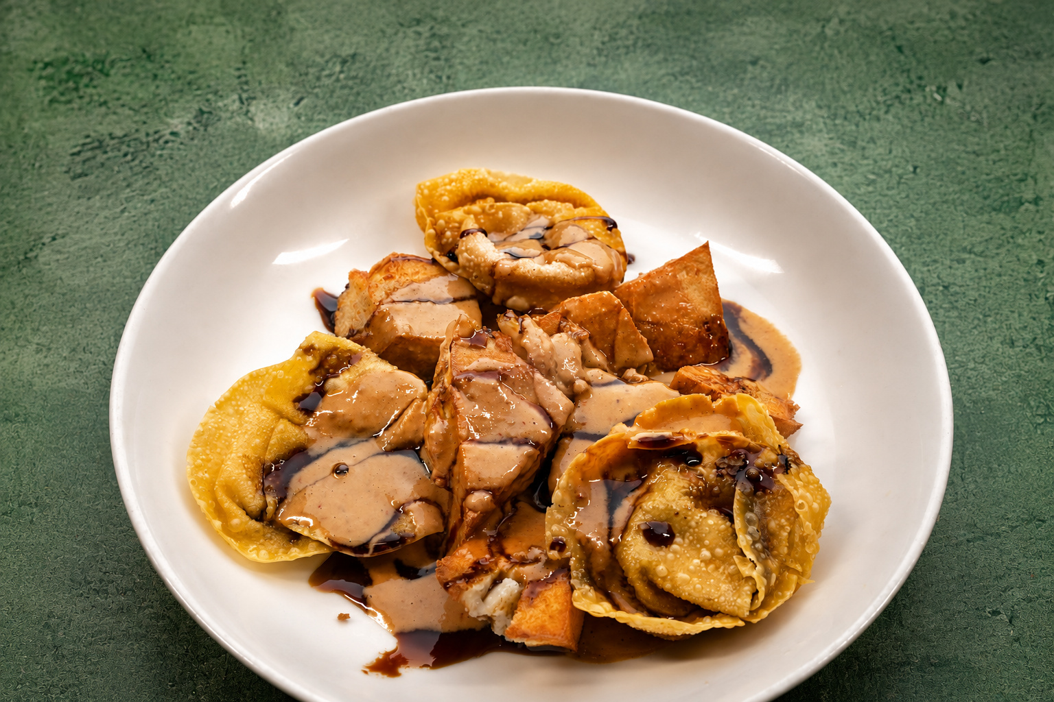 IBU: Batagor, fried dumplings with sauce — Indonesian restaurant food photography