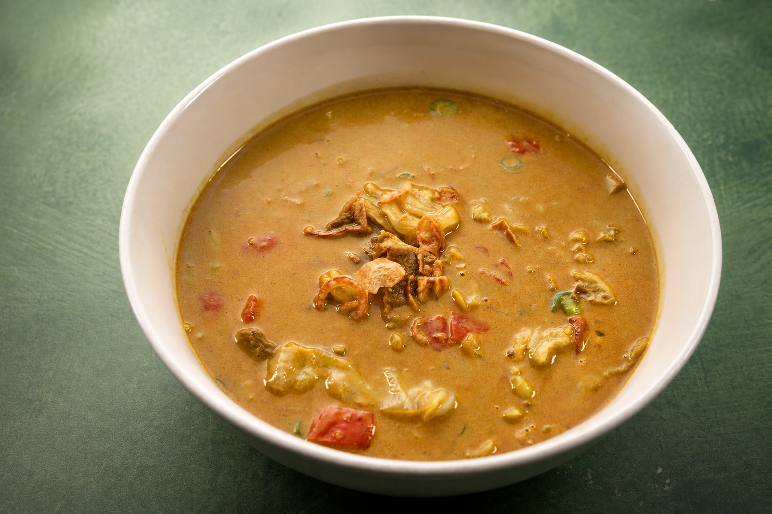 IBU: Creamy soup with fried shallots — Indonesian restaurant food photography