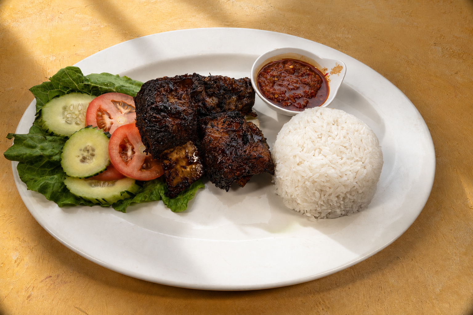 IBU: Grilled pieces with rice and sambal — Indonesian restaurant food photography