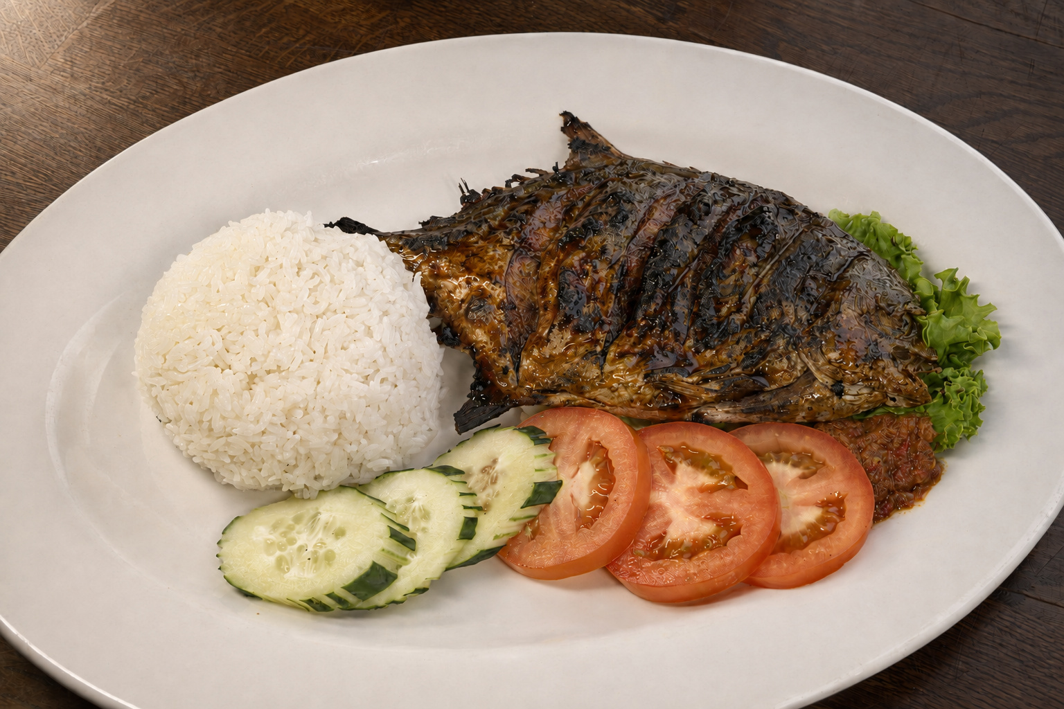 IBU: Ikan bakar, grilled fish with rice and sambal — Indonesian restaurant food photography