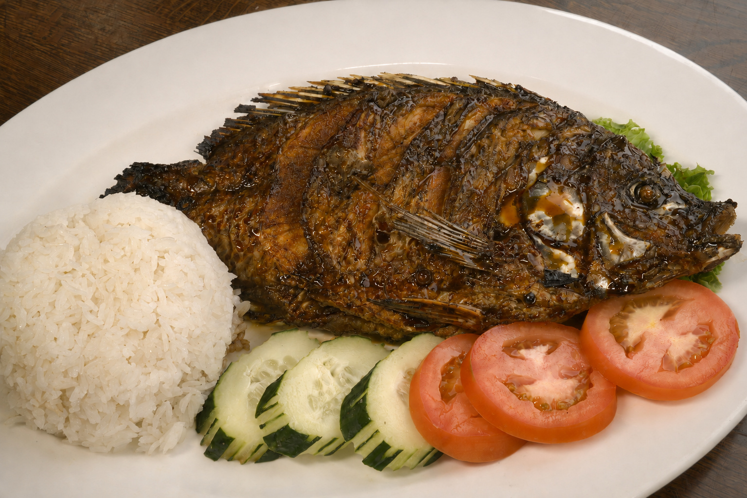 IBU: Ikan bakar, whole grilled fish with rice — Indonesian restaurant food photography
