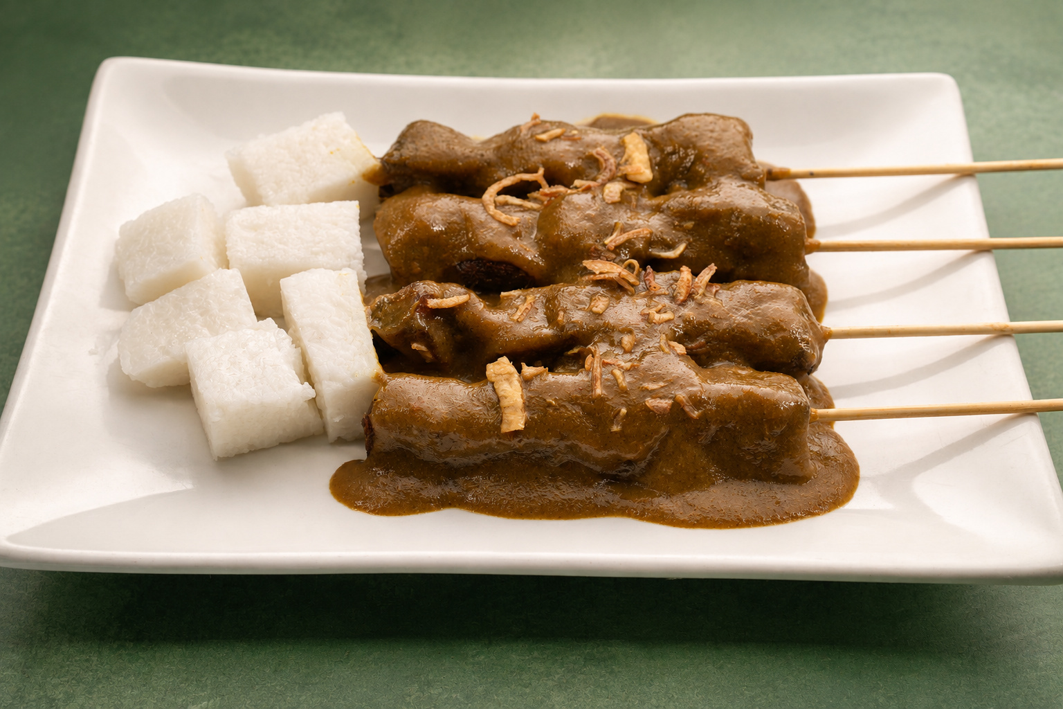 IBU: Sate bumbu kacang with lontong — Indonesian restaurant food photography