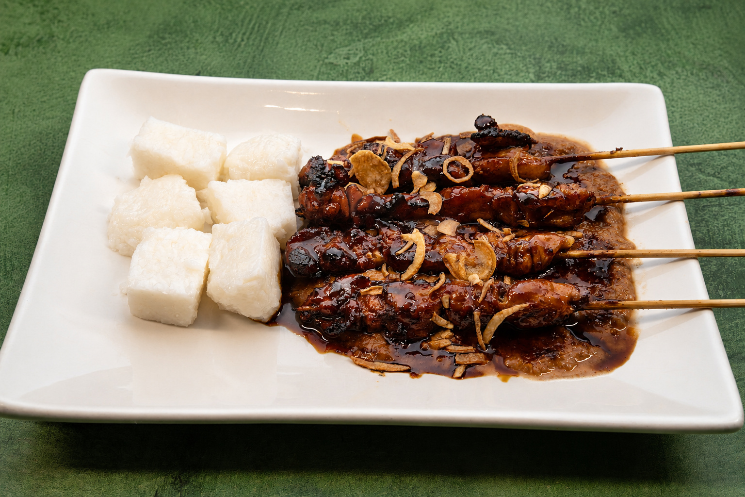 IBU: Sate kecap manis with lontong — Indonesian restaurant food photography