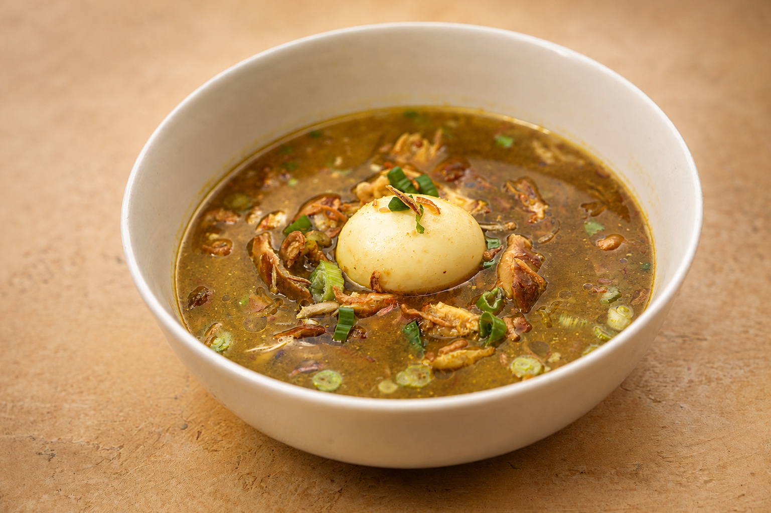 IBU: Soto soup with whole egg — Indonesian restaurant food photography