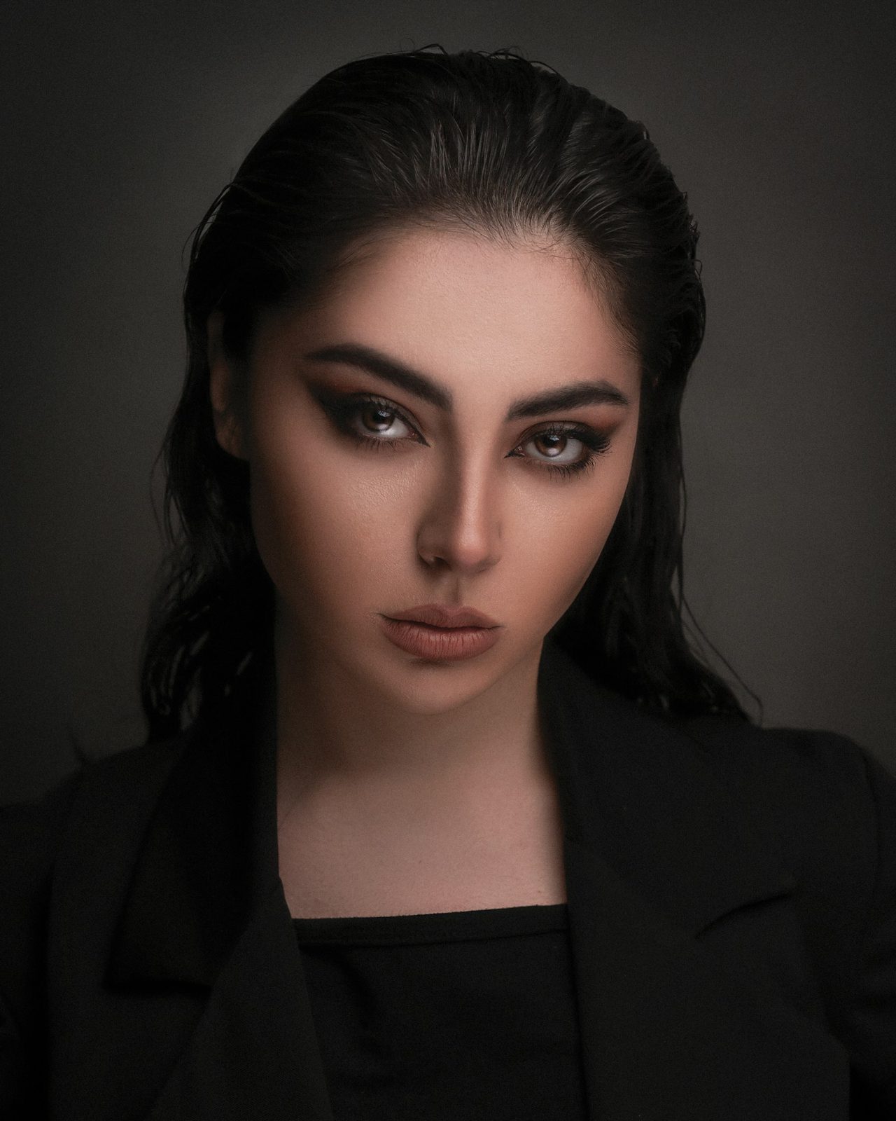 Editorial portrait in low-key lighting — personal branding